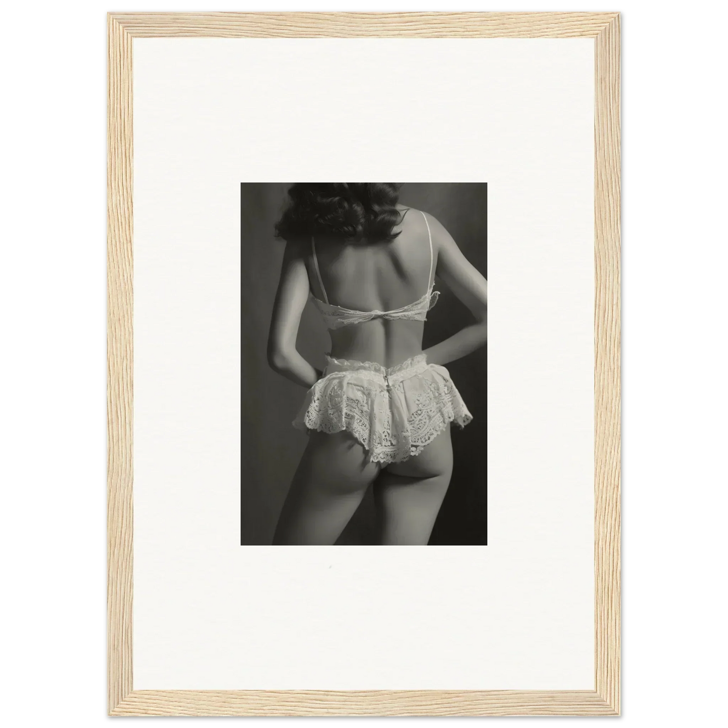 Black and white wall art of a woman in lacy lingerie, perfect for room decoration