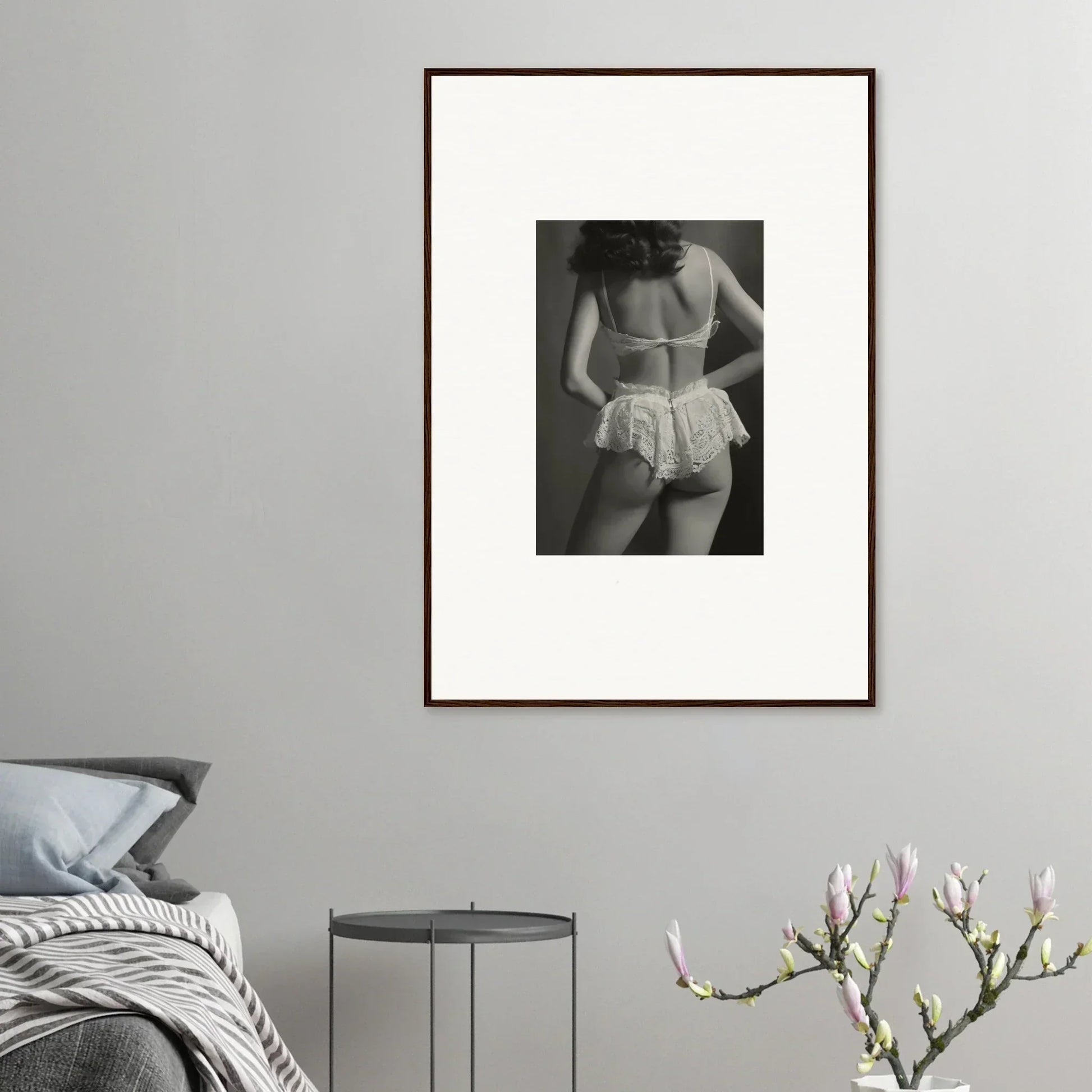 Framed black and white canvas print of a person in lacy underwear for stylish room decoration