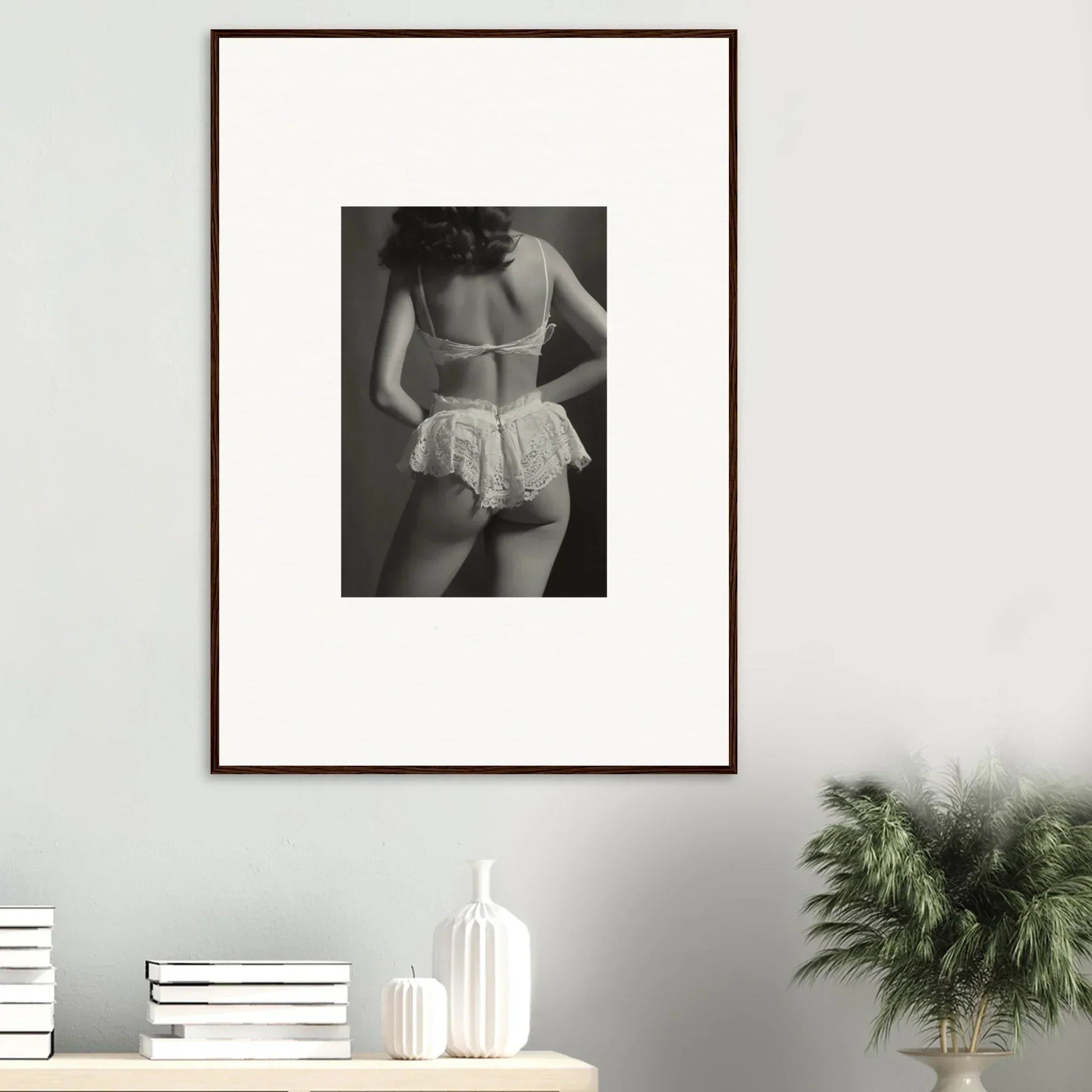 Framed black-and-white canvas print of a person in a lace skirt, perfect wall art for room decoration