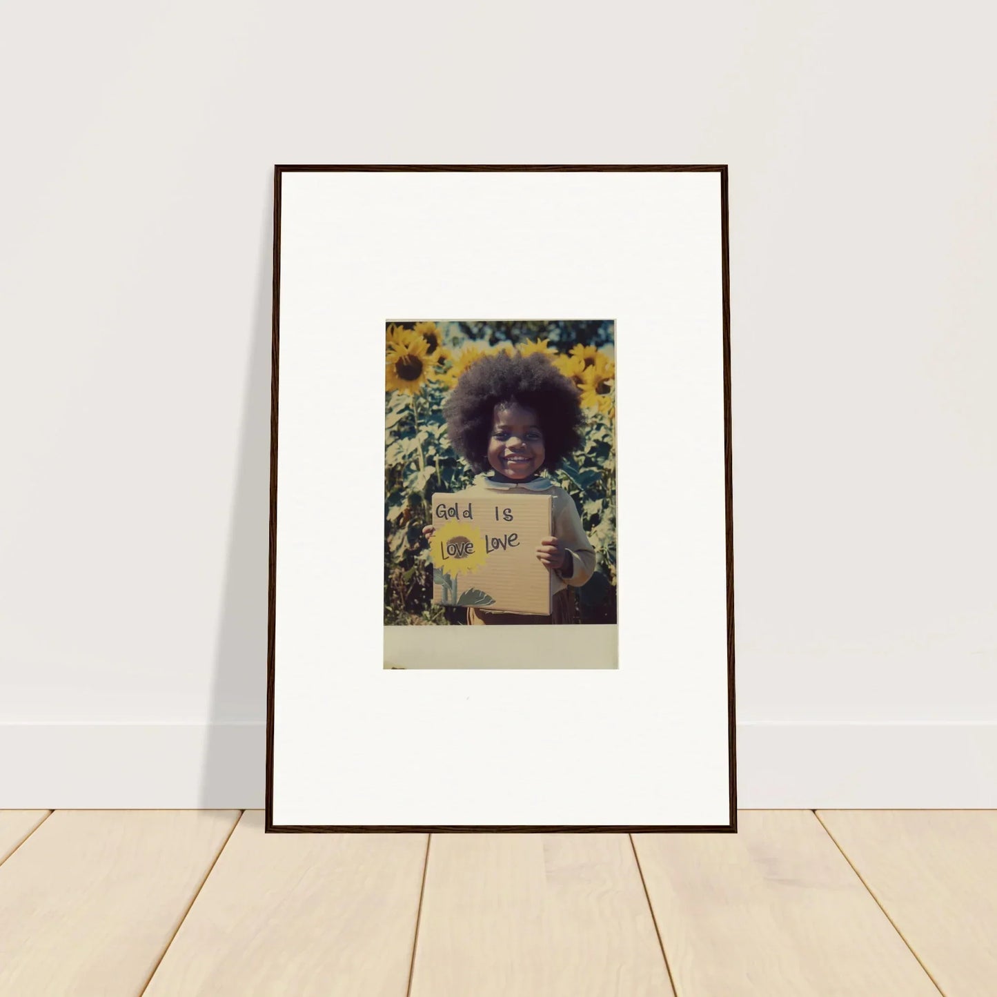 Person with an afro holding a sign in Sunflower Celestial Harmony artwork