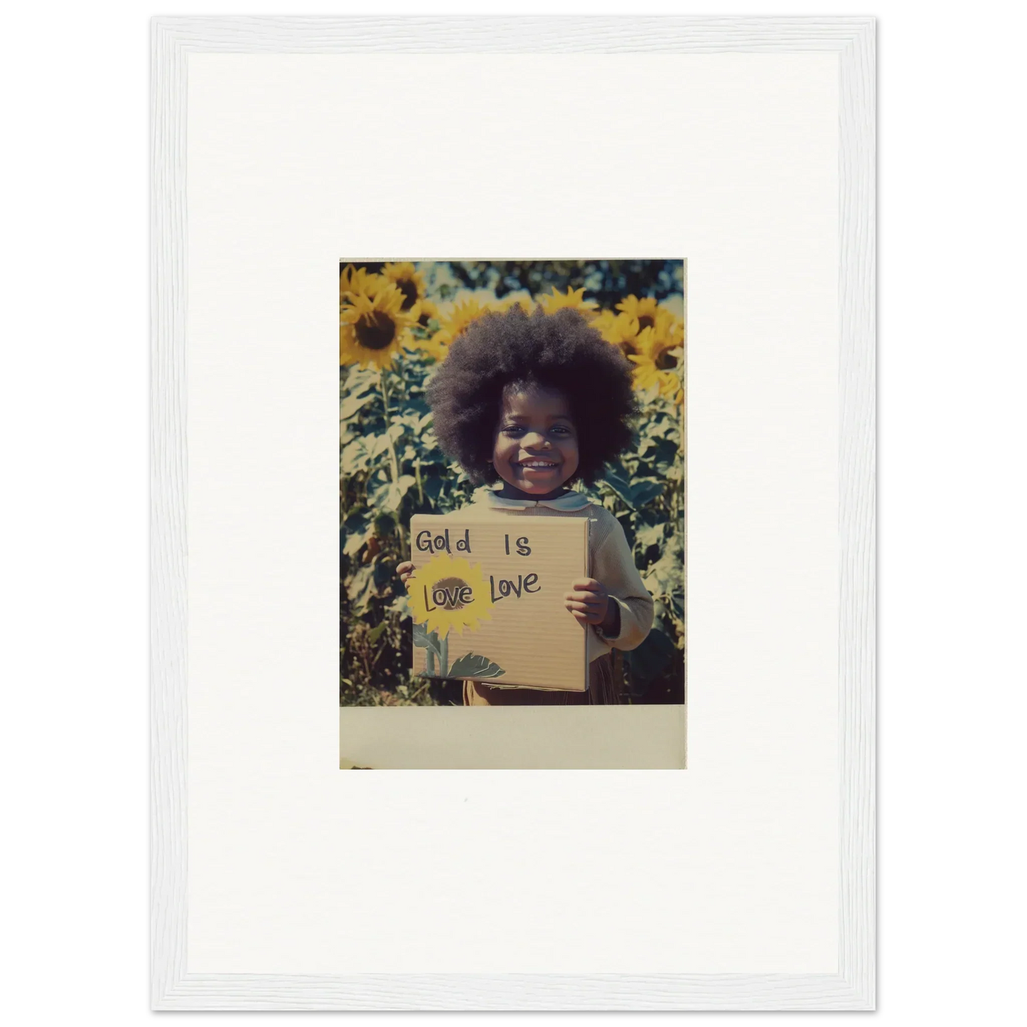 A framed Polaroid of Sunflower Celestial Harmony with a sign in a vibrant sunflower field