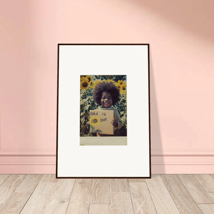 Framed photo of someone with an afro holding a sign from Sunflower Celestial Harmony