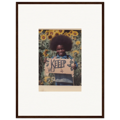 Child with KEEP WILD sign in sunflower field, perfect for a Freedom Symphony room decoration