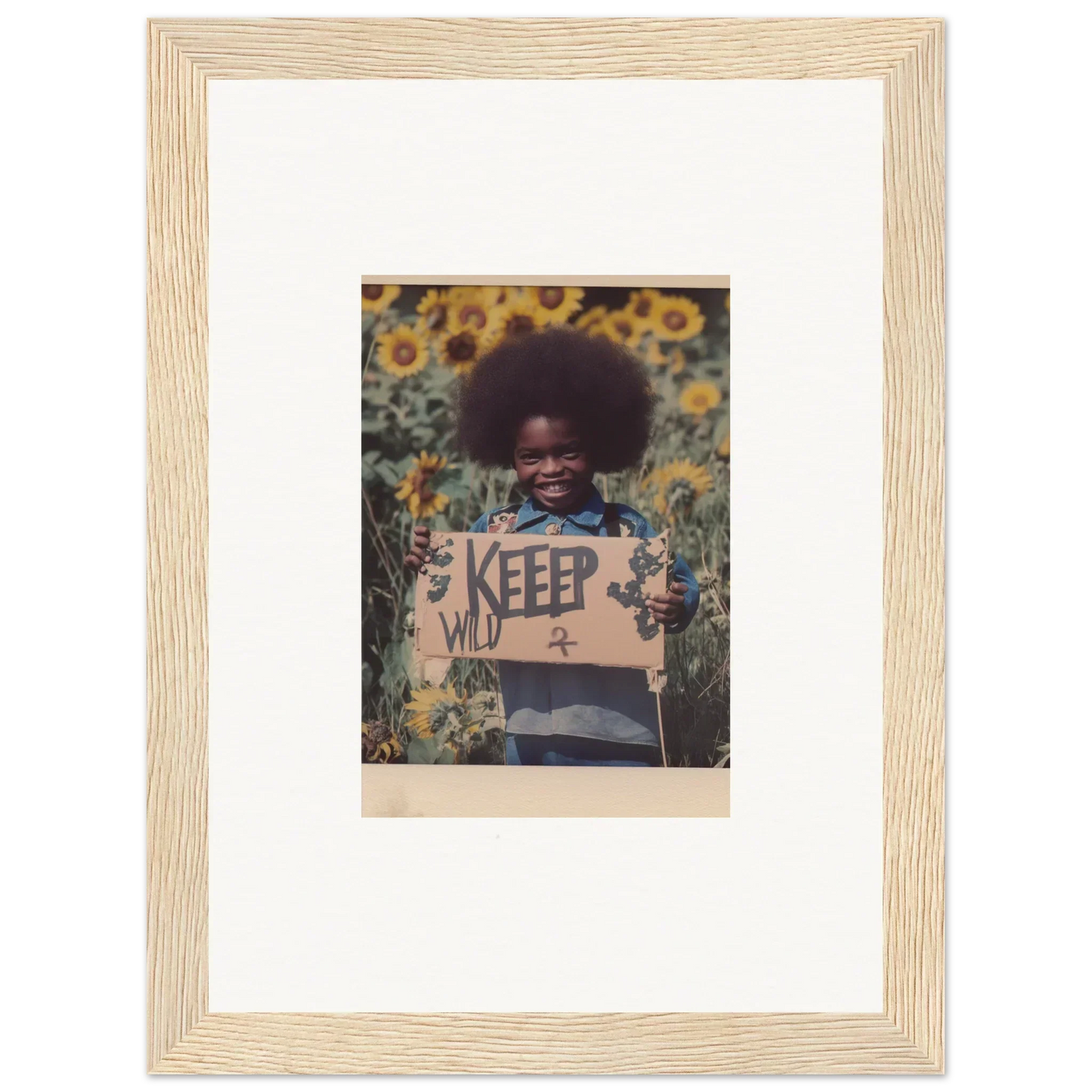 Framed photo of a child with a KEEP sign in a sunflower field for room decoration