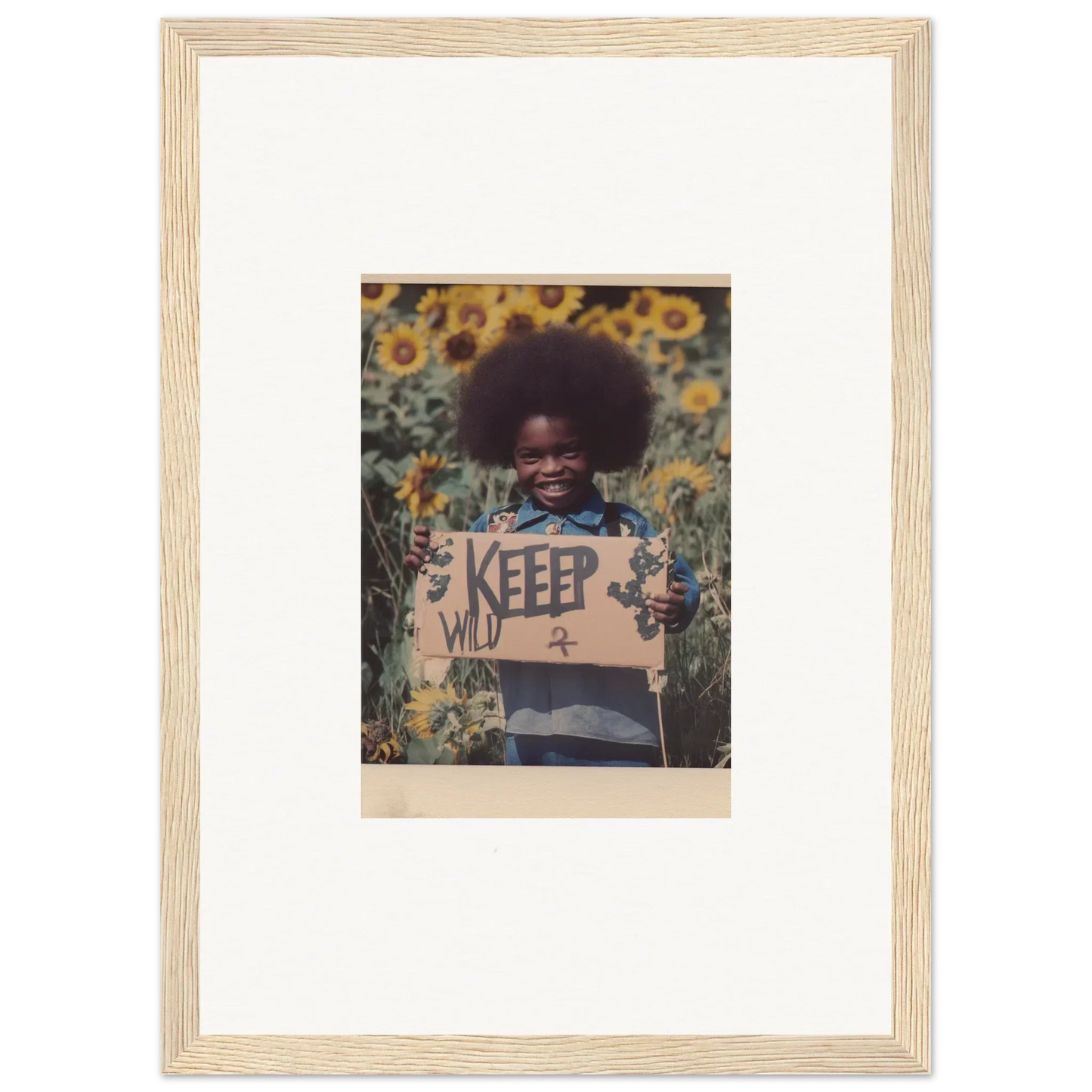 Framed photograph of a person with a KEEP sign in a sunflower field, perfect for room decoration