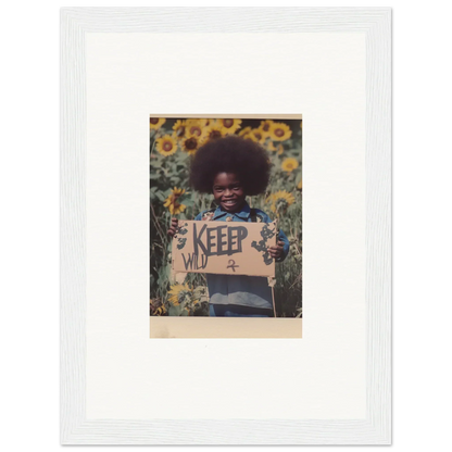 Framed photo of a person with afro and KEEP sign in a sunflower field for room decoration