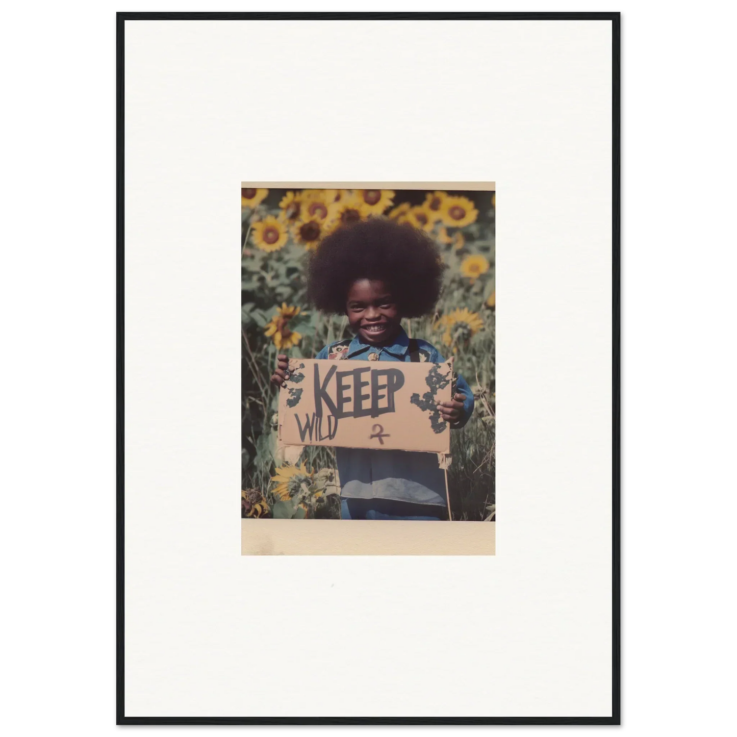 Framed photo of a child with a KEEP sign in a sunflower field for room decoration