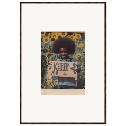 Framed photo of a person holding a KEEP sign in a sunflower field, perfect for room decoration