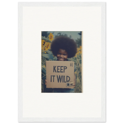 Framed photo of a person with a KEEP IT WILD sign from Sunflower Soulfulness Snapshot