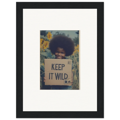 Framed photo of a person with a KEEP IT WILD sign, part of Sunflower Soulfulness Snapshot