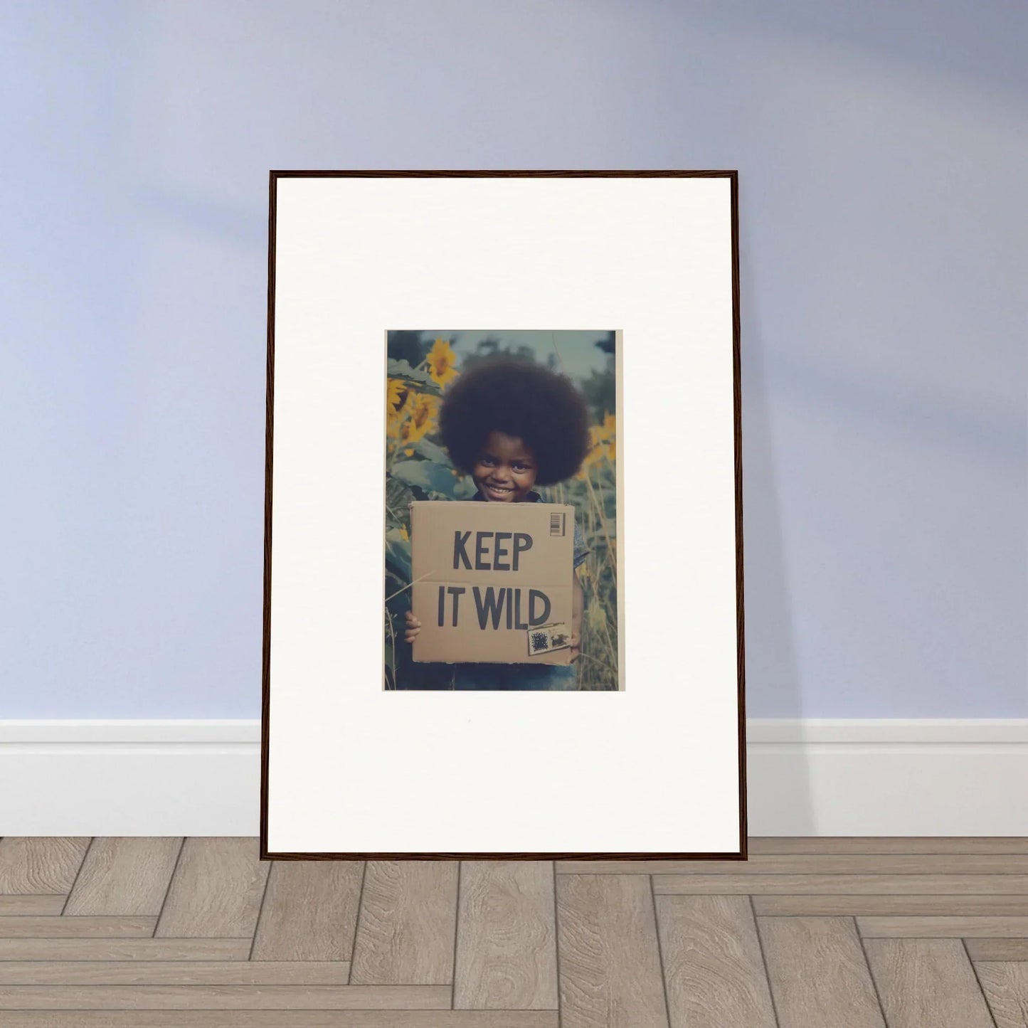 Framed artwork of a protest sign saying Keep It Wild on a floral backdrop in Sunflower Soulfulness Snapshot