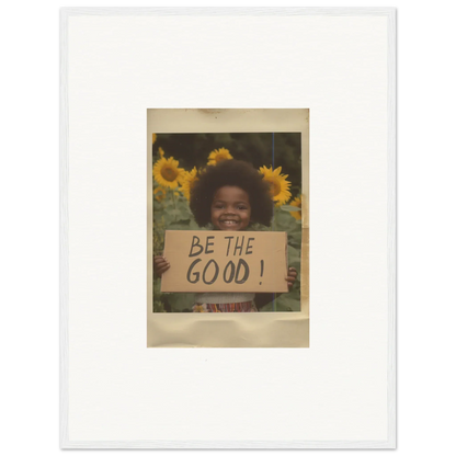 A vintage Polaroid of someone with a BE THE GOOD sign among sunflowers from Sunflower Utopia Surge