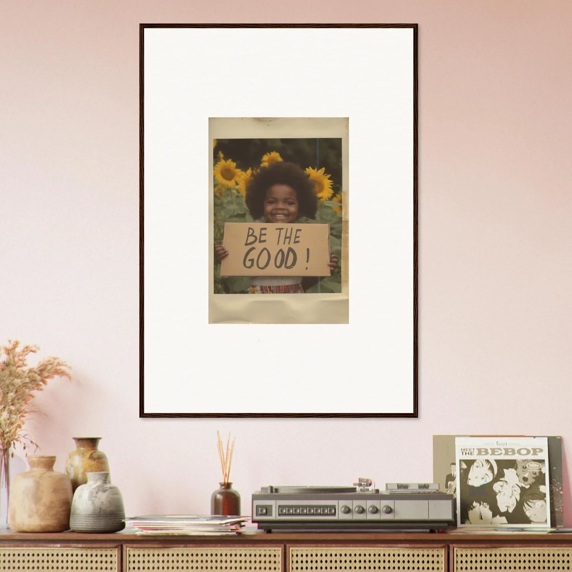 Framed wall art featuring sunflowers and a BE THE GOOD sign in Sunflower Utopia Surge