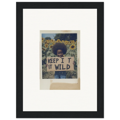 Framed photo of a person holding a KEEP IT WILD sign in Sunflower Wilderness Whispers