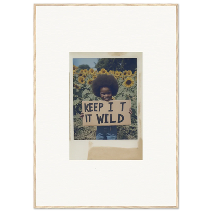 Framed photo of a person with a KEEP IT WILD sign in Sunflower Wilderness Whispers