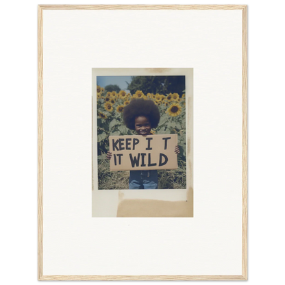 Framed photo of a person with a KEEP IT WILD sign in Sunflower Wilderness Whispers