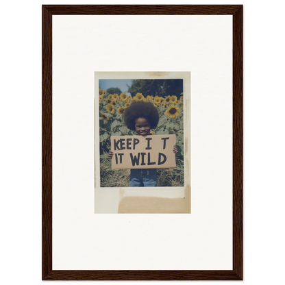 Framed photo of a person with a KEEP IT WILD sign in Sunflower Wilderness Whispers