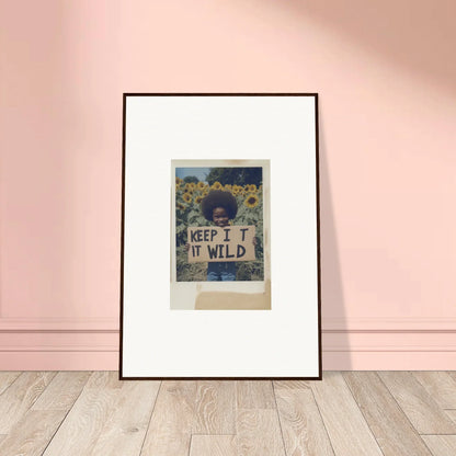 Framed print of a person in sunflowers with KEEP IT WILD text, Sunflower Wilderness Whispers