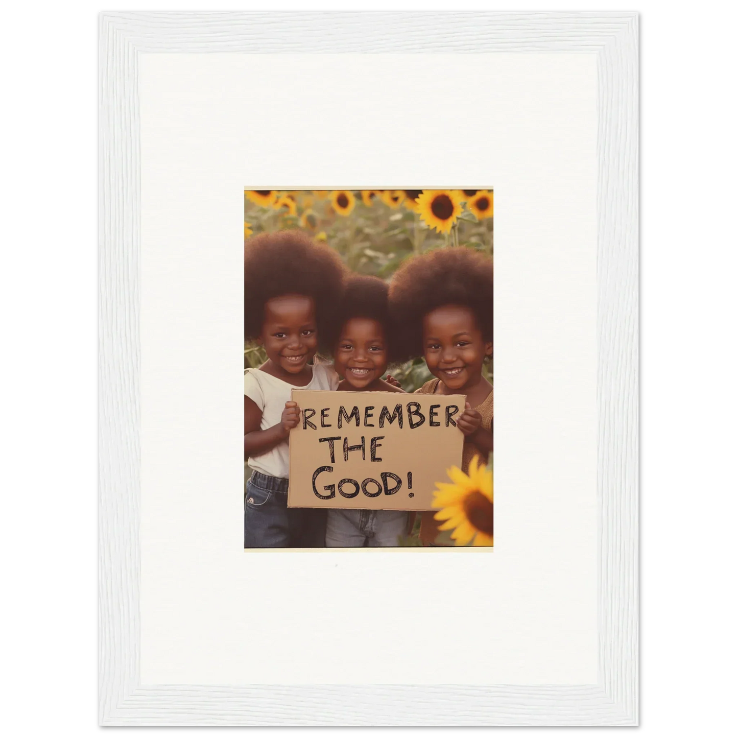 Three kids with a sign saying REMEMBER THE GOOD against sunflowers, perfect for room decoration