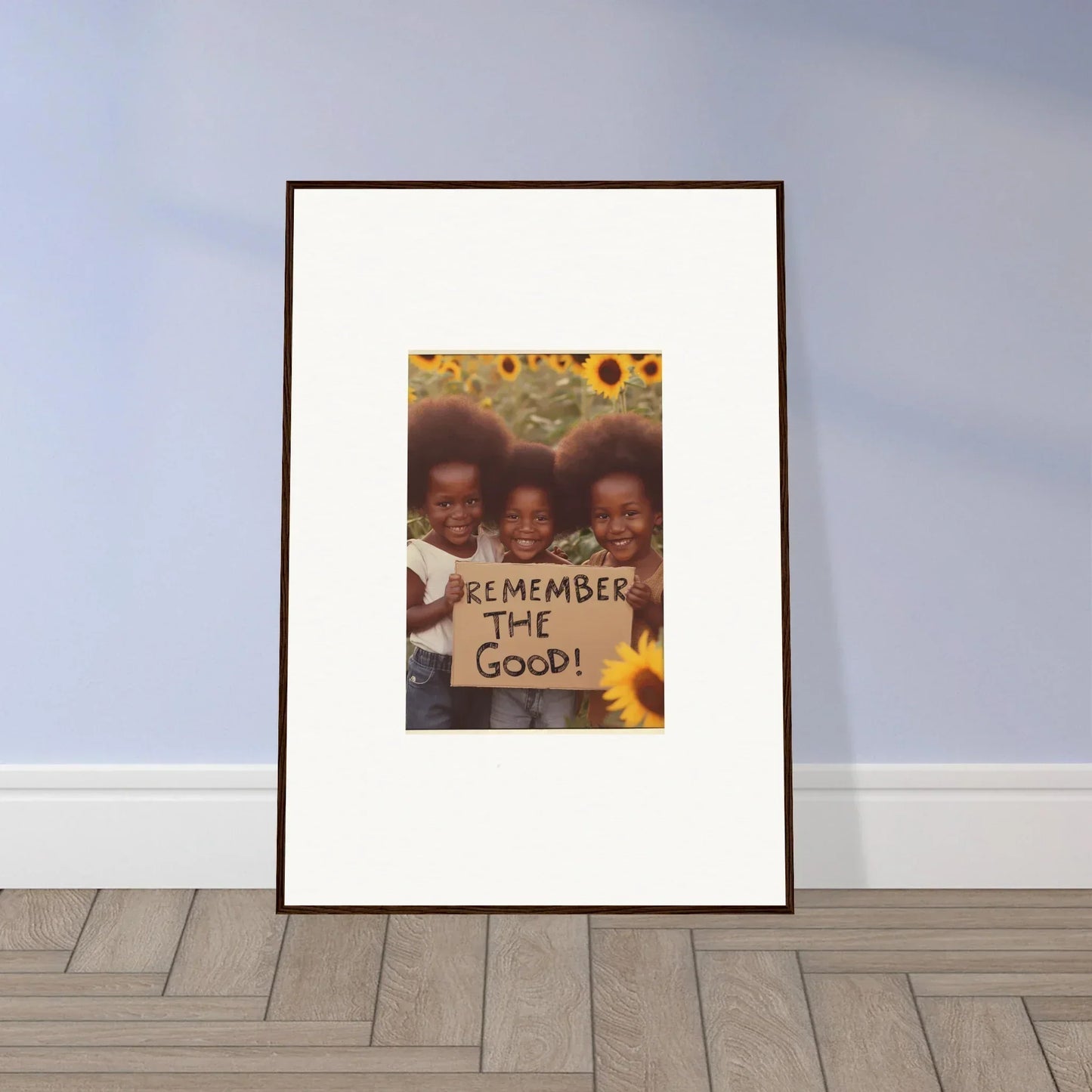 Framed photograph of three kids with a sign and sunflowers, perfect for room decoration