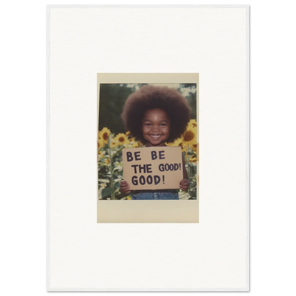 Framed wall art of a Polaroid with a BE THE GOOD sign in sunflowers, Sunflower’s Gentle Whisper