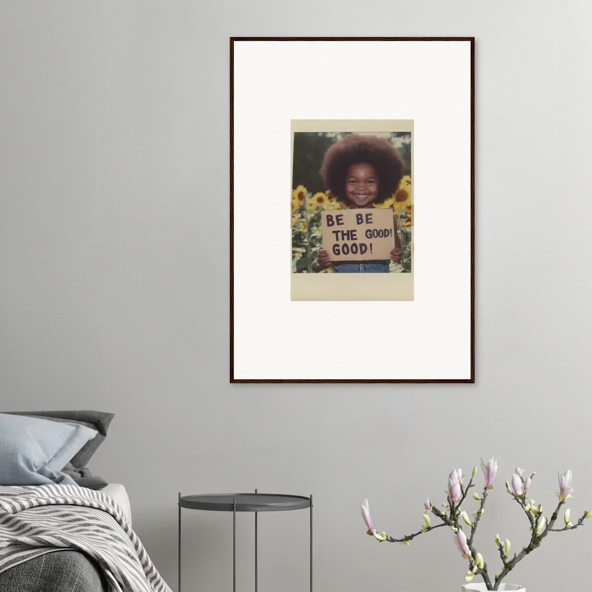 Framed wall art of a person with a BE THE GOOD sign in sunflowers for Sunflower’s Gentle Whisper