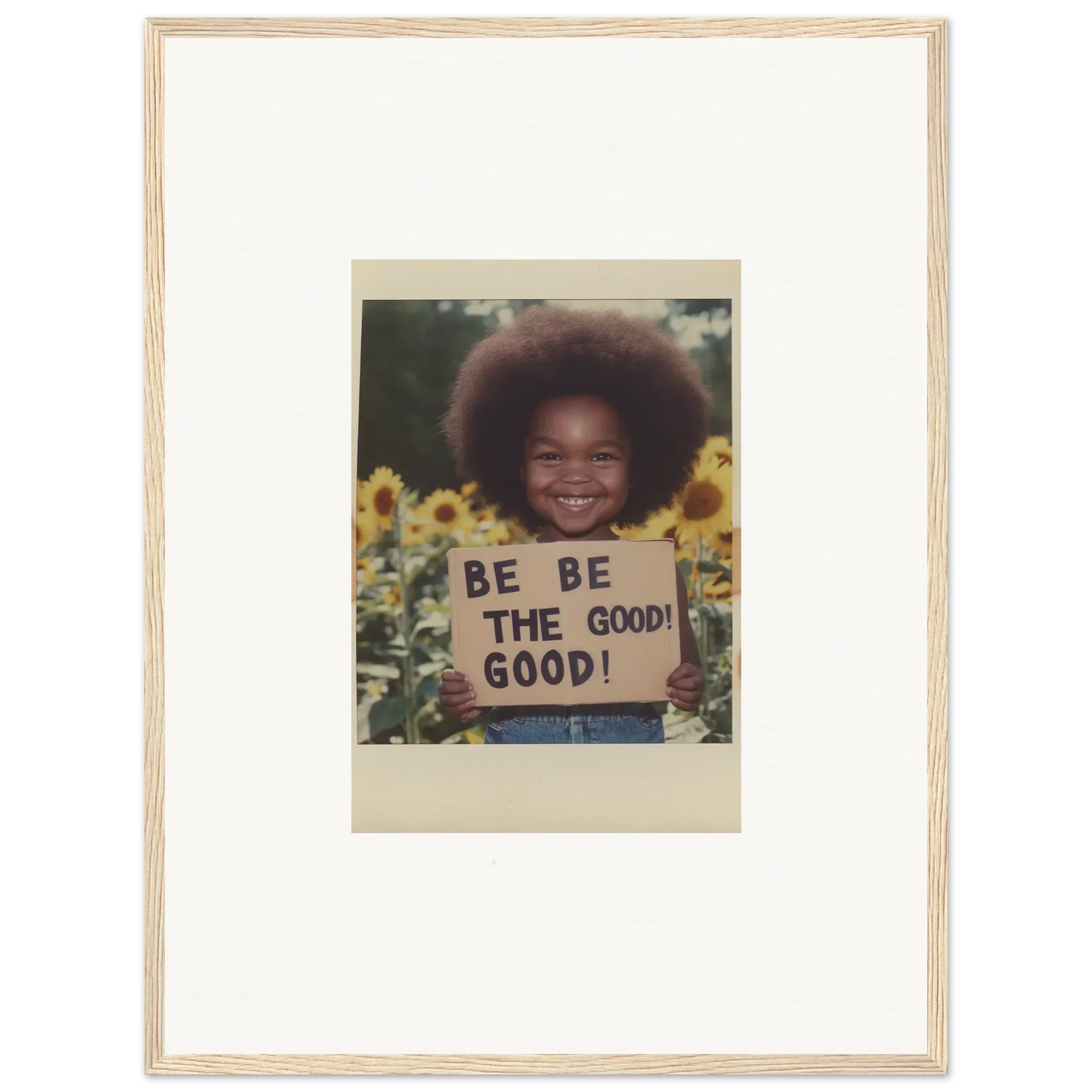 Framed wall art of Be The Good sign in sunflower’s gentle whisper field