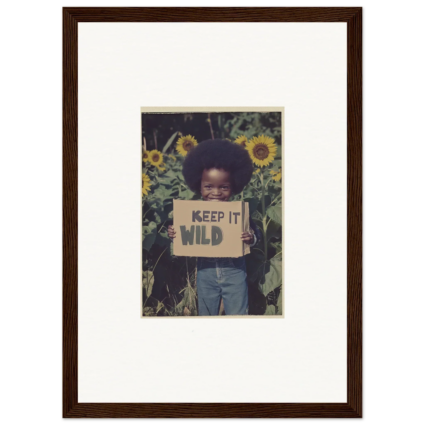 Framed photo of a person with a KEEP IT WILD sign among sunflowers for cosmic room decoration