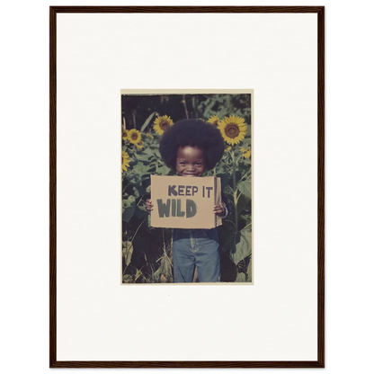 Child with KEEP IT WILD sign in sunflowers for cool Cosmos Unchained canvas print