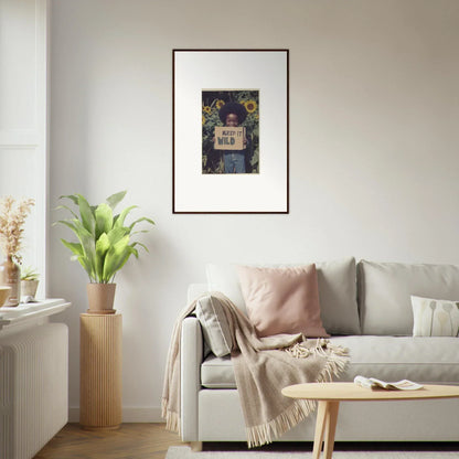 Framed canvas print of a person with a book in a sunflower-filled cosmos unchained scene