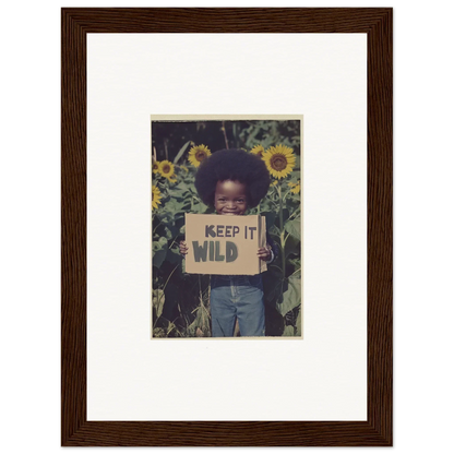 Framed canvas print of a child with a KEEP IT WILD sign in sunflowers for room decoration