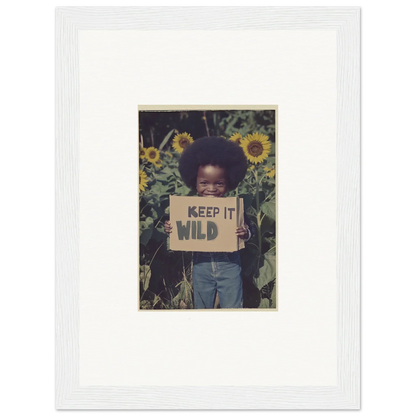 Person with a KEEP IT WILD sign in sunflowers, perfect for Cosmos Unchained room decoration