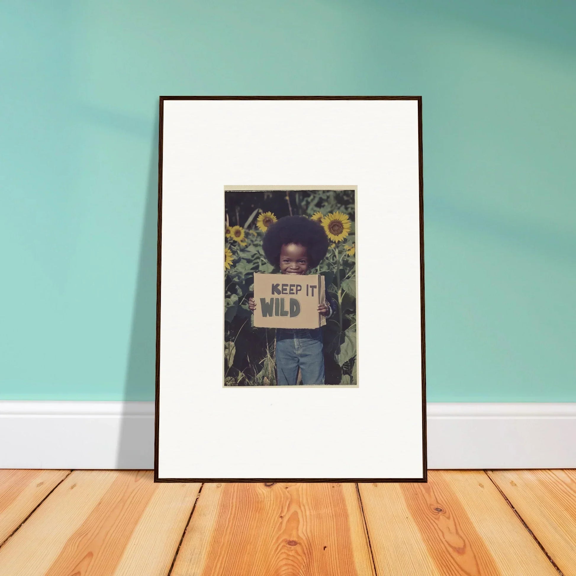 Framed canvas print of person with KEEP IT WILD sign in sunflowers for room decoration