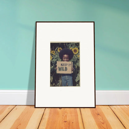 Framed canvas print of person with KEEP IT WILD sign in sunflowers for room decoration