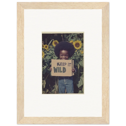 Child with KEEP IT WILD sign among sunflowers for a vibrant cosmos unchained canvas print