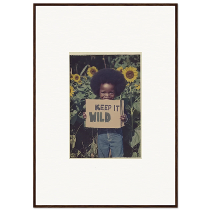 Framed photograph of a person with KEEP IT WILD sign in sunflowers for cosmos unchained room decoration