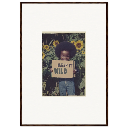 Framed photograph of a person with KEEP IT WILD sign in sunflowers for cosmos unchained room decoration