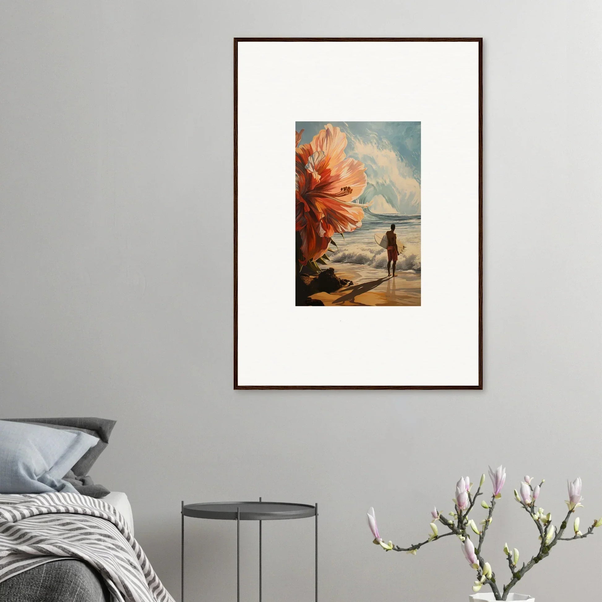 Framed wall art of a beach scene with a silhouetted figure and floral infamy flower