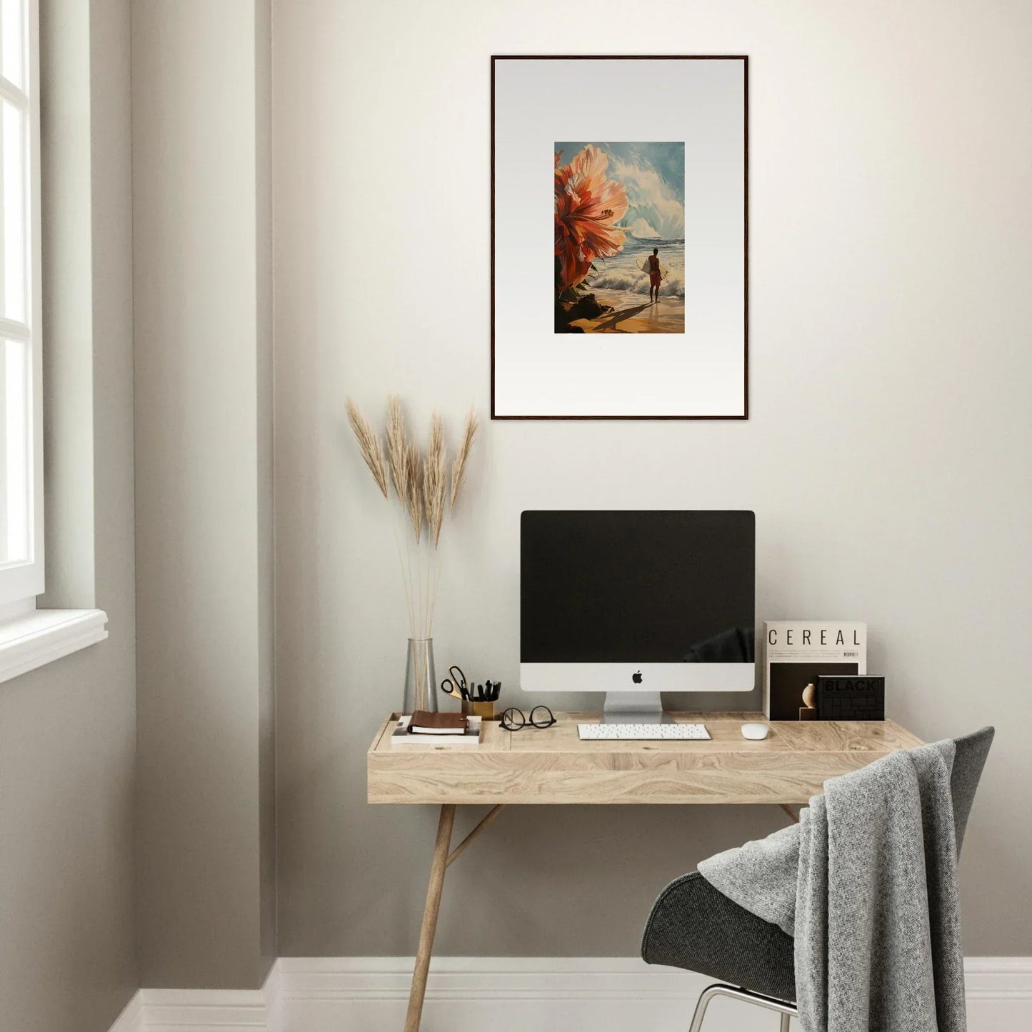 Minimalist home office with a wooden desk, computer, and Floral Infamy wall art