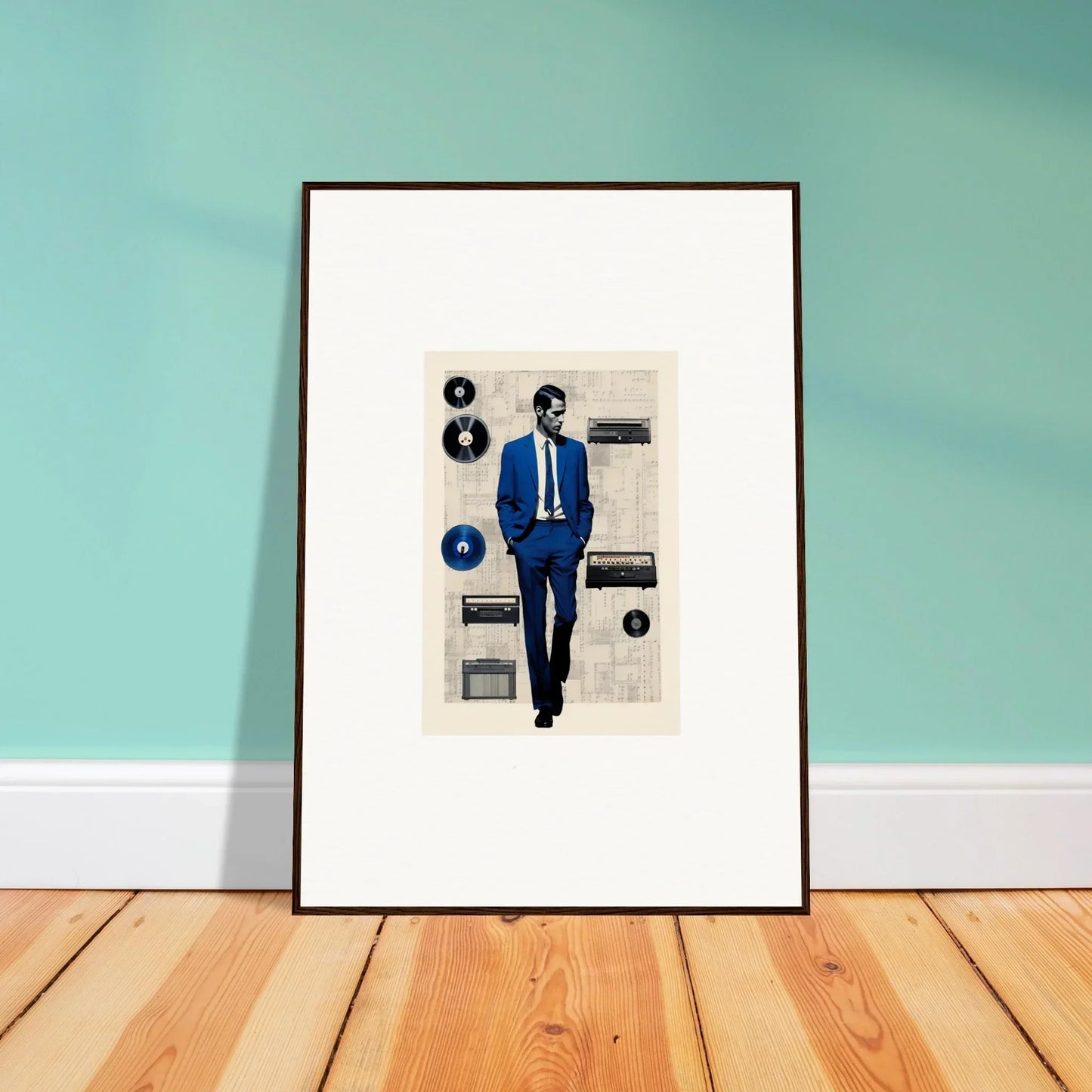 Framed artwork of a figure in a blue suit surrounded by vinyls from Surreal Greeting Reverieonaut