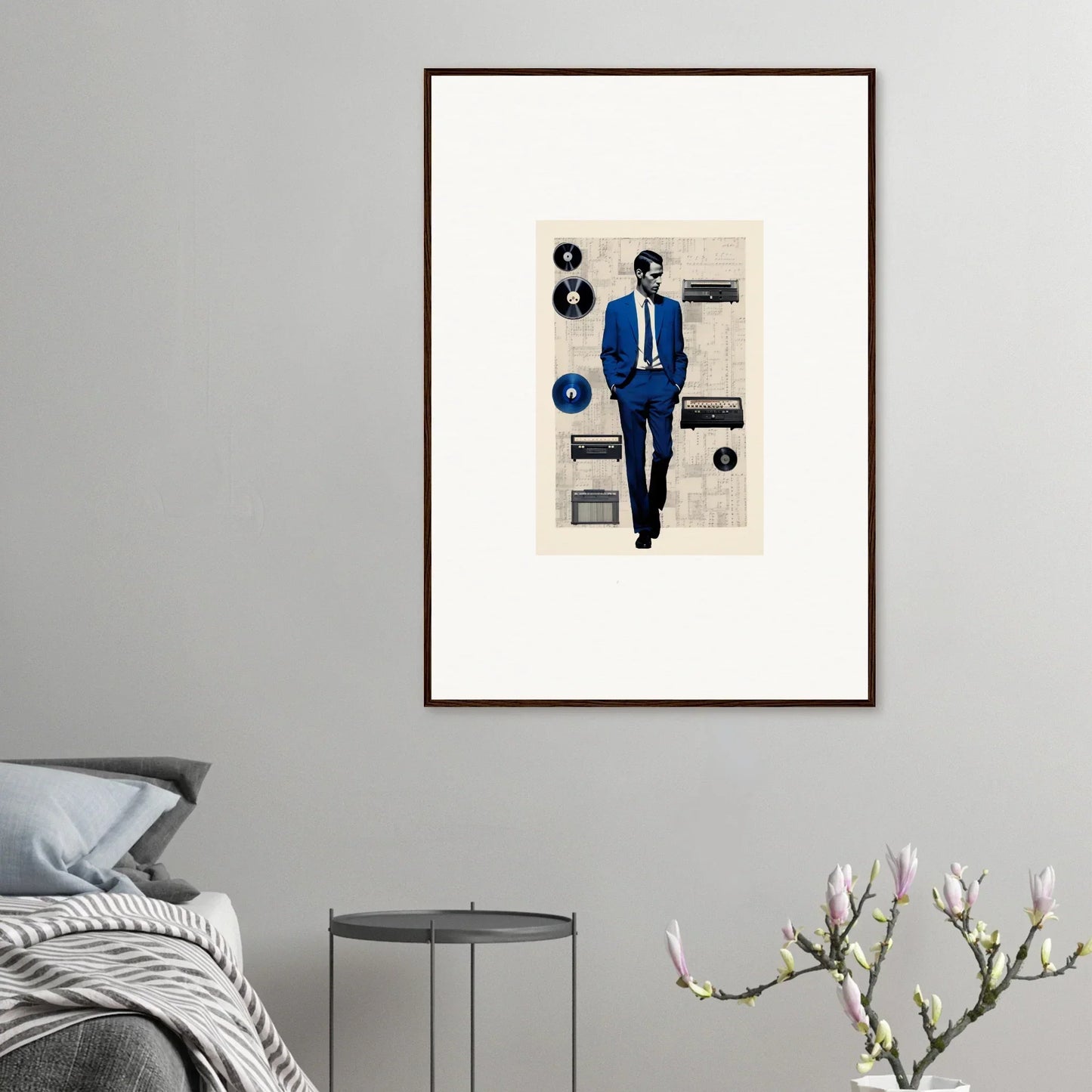 Framed artwork of Surreal Greeting Reverieonaut with a figure in a blue suit and floating vinyls