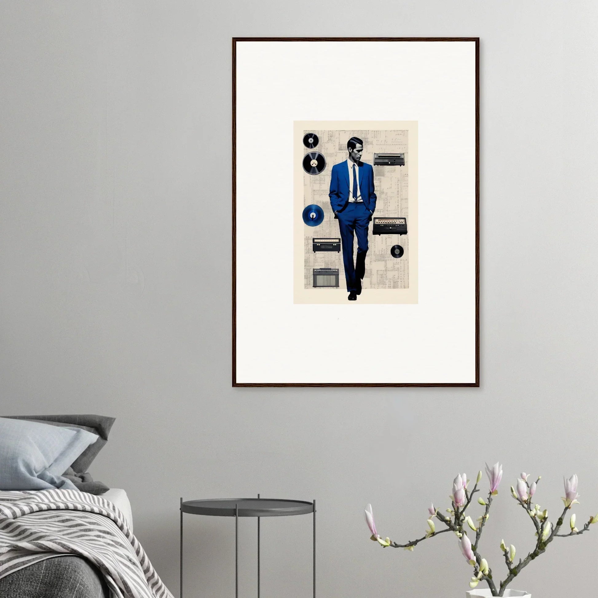 Framed artwork of Surreal Greeting Reverieonaut with a figure in a blue suit and floating vinyls