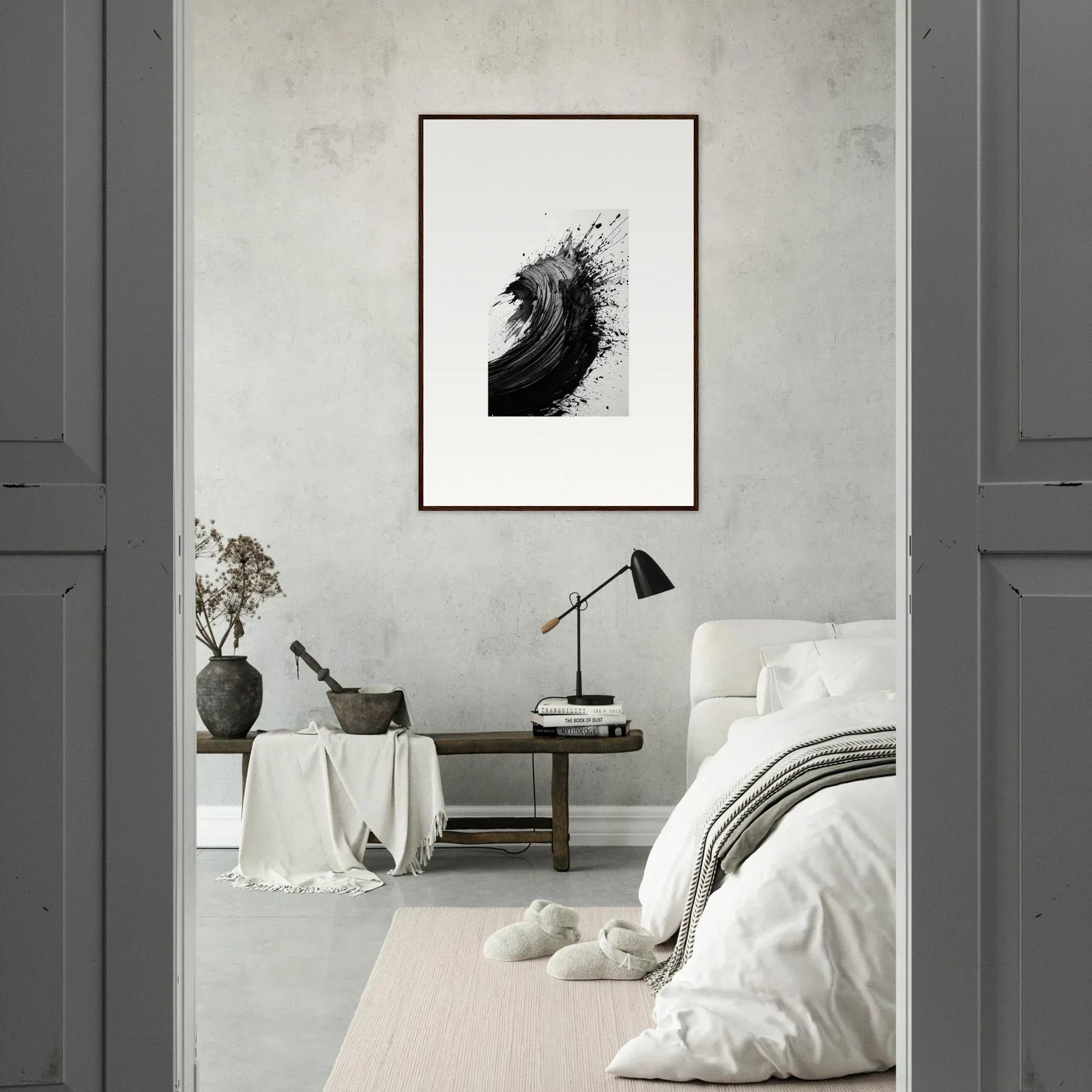 Minimalist bedroom featuring striking black and white framed wall art for modern room decor