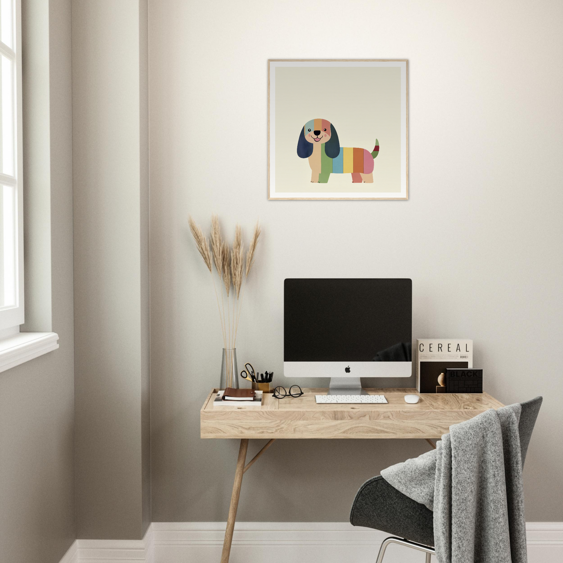 Simple wooden desk featuring an iMac display with Technicolor Dog Dreaming art