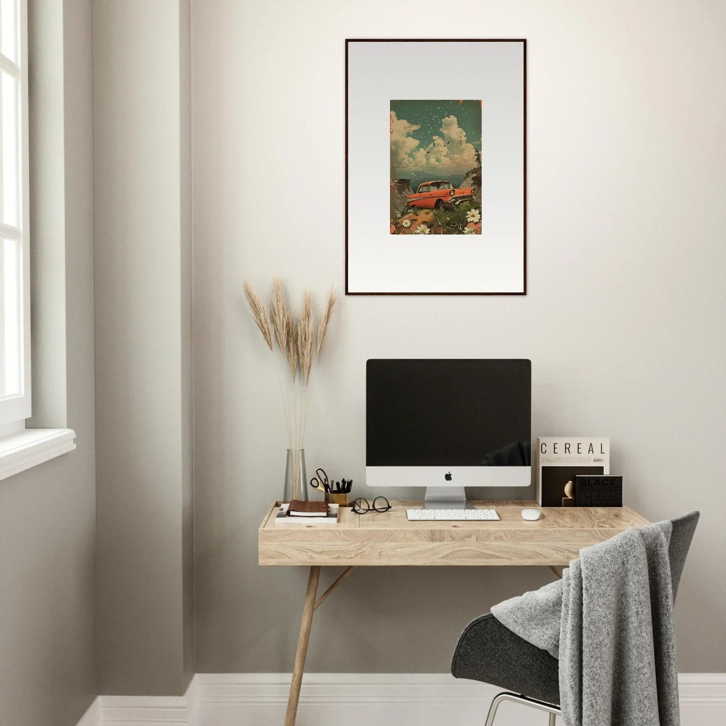 Minimalist wooden desk with computer monitor and canvas print for stylish room decoration