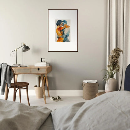 Framed abstract canvas print of two figures embracing in orange and blue tones for room decoration