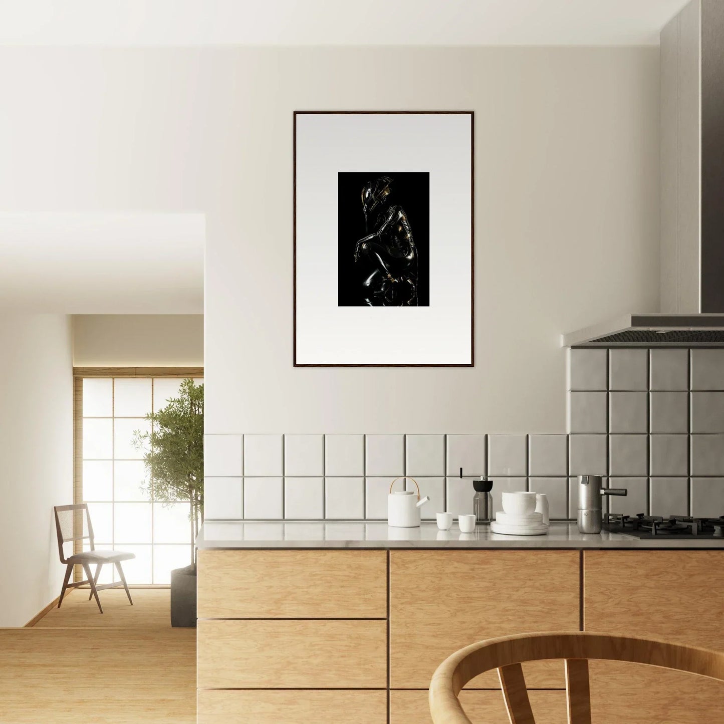 Modern kitchen with wooden cabinetry and a framed black and white artwork on the wall.