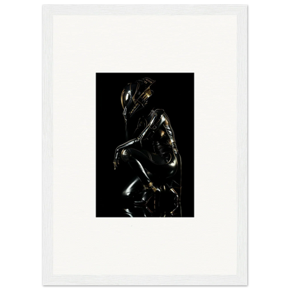 Glossy black sculpture of a crouching humanoid figure with reflective highlights.