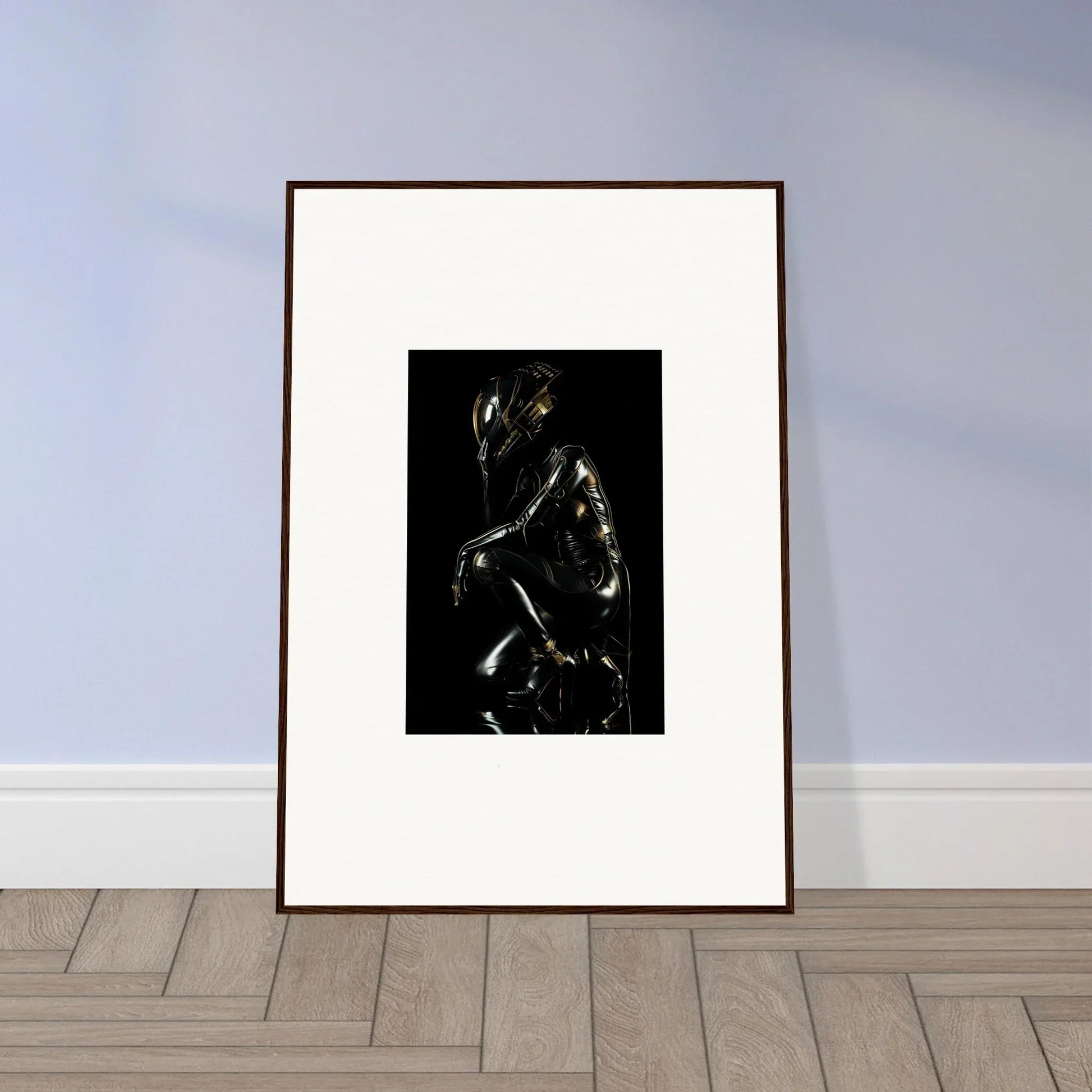 Framed artwork depicting a dark, shadowy human figure against a black background.