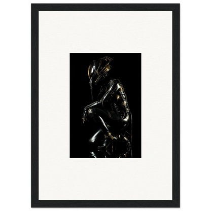 Shiny metallic sculpture of a crouching humanoid figure with an elongated head.